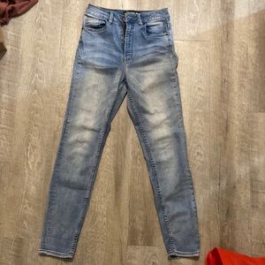 High waisted light blue jeans